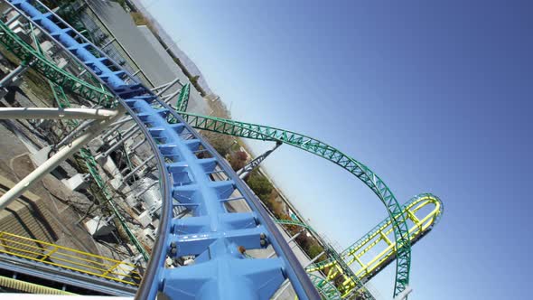 First person view of a roller coaster riding the peaks and slopes of the track