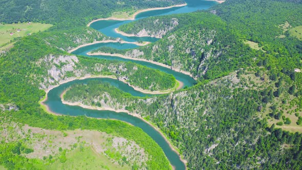 Winding Blue River Meandri Cehotine on the Mountains with Green Forest in Pljevlja Montenegro