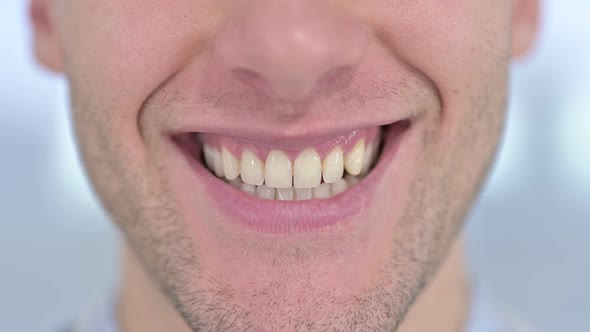 Close Up of Mouth of Young Male Smiling at the Camera 