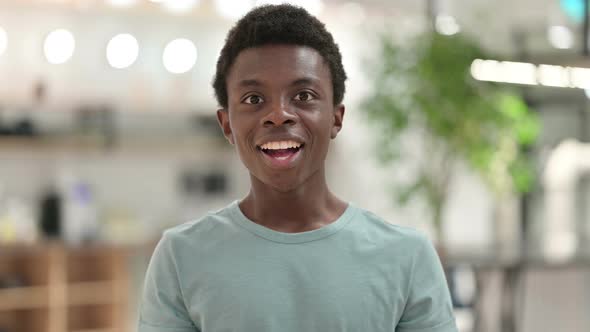 Excited Young African Man Celebrating Success