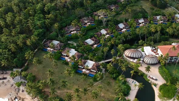 Aerial over idyllic Sri Lanka Beach. Palm trees and waves on sand beach. Tangalle, Sri Lanka