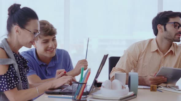 Group Meeting of Creative Business People Designer and Artist at Office Desk