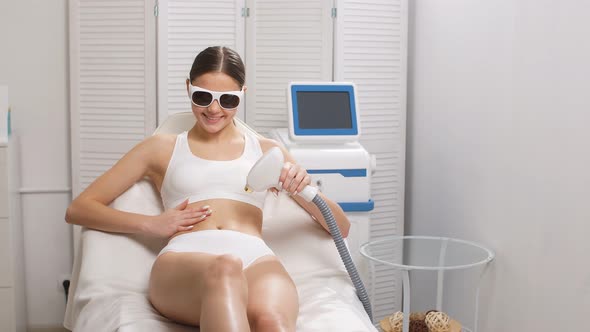 Attractive Lady in Protective Eyeglasses, Get Hair Removal Procedure.