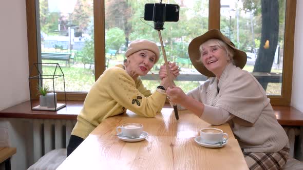 Women Taking Selfie in Cafe