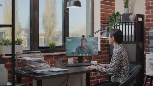 Business Woman Using Video Call Meeting to Talk to Colleague