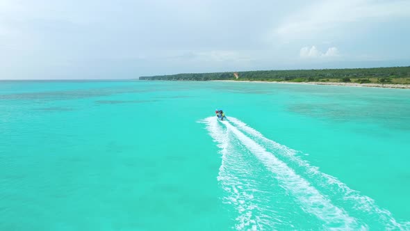 Aerial tracking of speedboat sailing at Bahia de las Aguilas. Dominican Republic