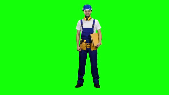 Foreman Holds a Folder in His Hands and Shows a Thumbs Up. Green Screen