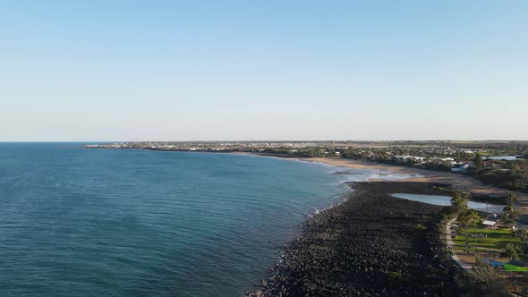 A high revealing drone video looking south showing the raw rugged coastline of the small town of Bar