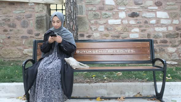 Muslim Woman Texting Message Phone