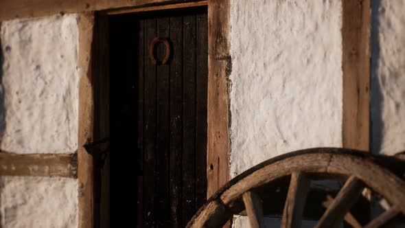 Old Wood Wheel and Black Door at White House