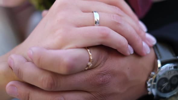 Bride and Groom Holding Hands Outdoors