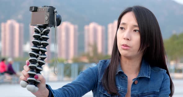 Woman taking vlog on camera