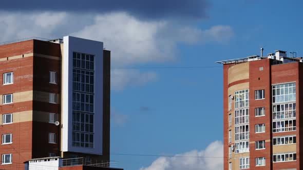 Building on a Background of Clouds Drifting