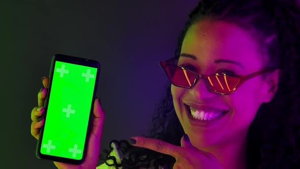 Portrait Young Lovely Female African American Points Finger Smartphone Green Screen Chroma Key Shows