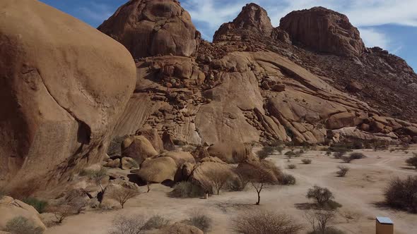 Massive round rocks and huge mountains, Erongo, Namibia, aerial shot