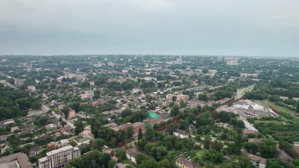 Aerial View of a Small Town Urban Landscape Flying By Houses Near Green Spaces