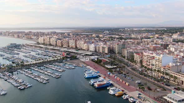 Puerto Santa Pola, Alicante, Spain. Spanish Coast Pier Marina Docks With Boats, Ships, And Yachts.