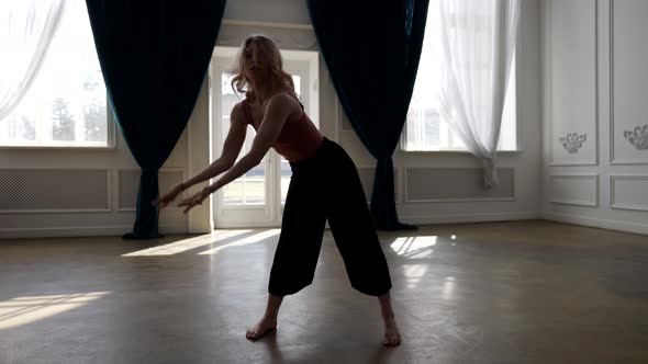 Sensual Blonde Lady is Dancing Modern Dance in Hall Rehearsing Contemporary Choreography