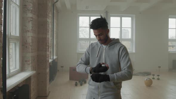 Afro-American Boxer Wrapping Hands At Training