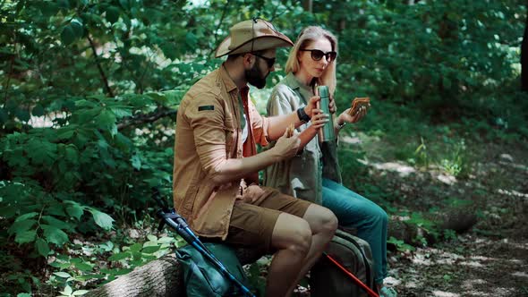 Backpack Hiker On Picnic In Forest Camping. Sticks Walking On Jungle. Hiker Hiking Relax Adventure.