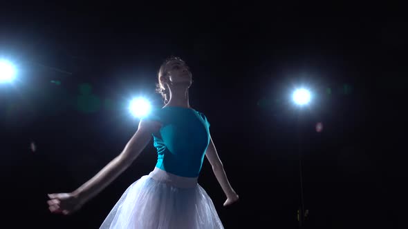 Gracefully Ballerina in White Tutu Dancing Classical Ballet Elements