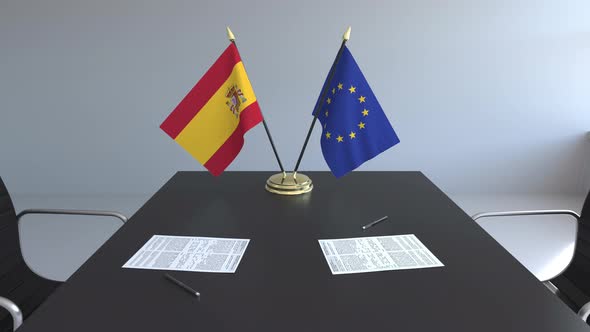 Flags of Spain and the European Union on the Table