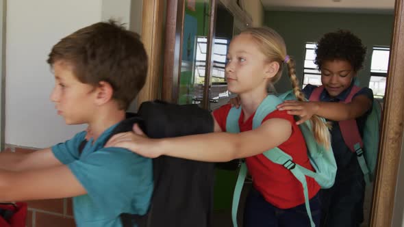 Group of kids walking in a queue in school