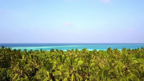 Drone Flying Over The Island With Palm Trees With The Turquoise Ocean View In Maldives Indian Ocean