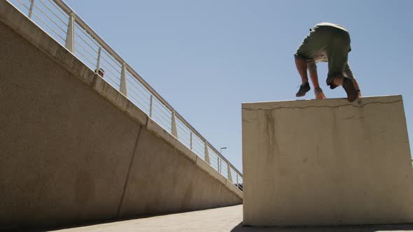 Caucasian men practicing parkour