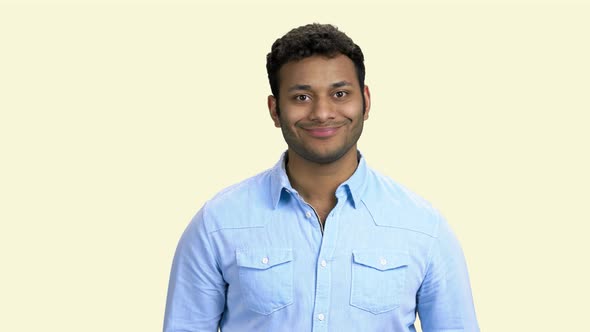 Portrait of Happy Indian Guy on White Background