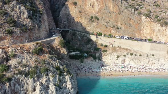 Aerial of European tourists sun bathing at Kaputas on a white sandy beach with turquoise blue water