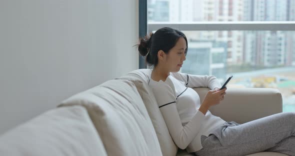 Woman use of smart phone at home