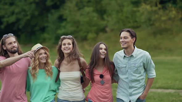 Happy Friends Having Fun Outdoors In Nature