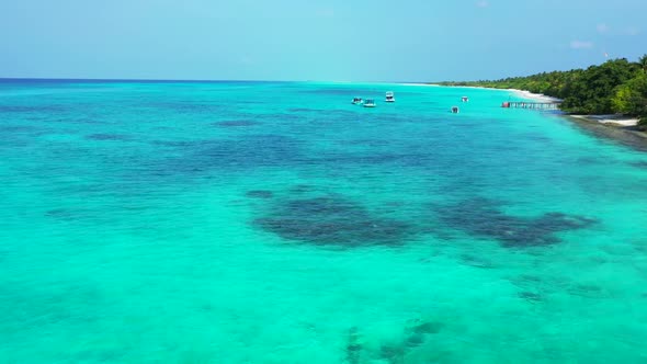 Aerial drone view landscape of relaxing coastline beach trip by blue green ocean and white sand back