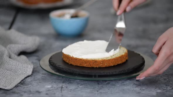 Pastry Chef Makes a Layered Cake with Prune and Whipping Cream