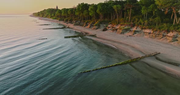 Beach by Baltic sea at sunrise in Poland.