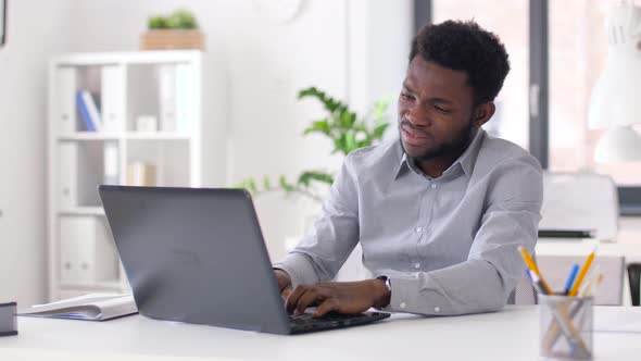 Stressed Businessman with Laptop at Office 14