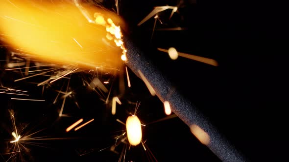 Bengal Fire New Year Sparkler Candle Sparkling Lights Burning on Black Background Closeup Macro