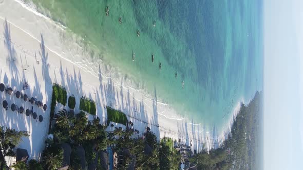 Vertical Video of the Ocean Near the Coast of Zanzibar Tanzania Aerial View