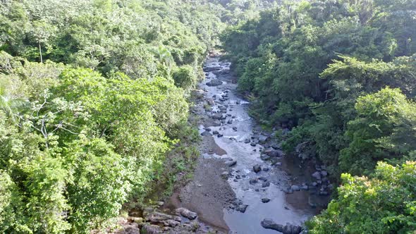 Countryside Landscape With Lush Vegetation And River (Rio Higuero) In Dominican Republic - aerial dr