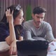 young asian caucasian couple checking bills,discussing planning budget together - VideoHive Item for Sale