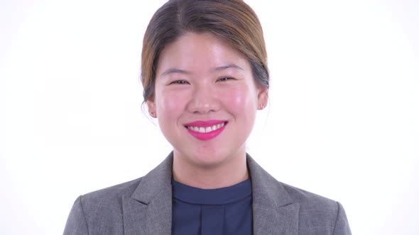 Face of Happy Young Beautiful Asian Businesswoman Smiling