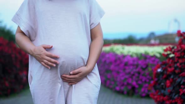 Happy Pregnant Woman and Expecting Baby at Home