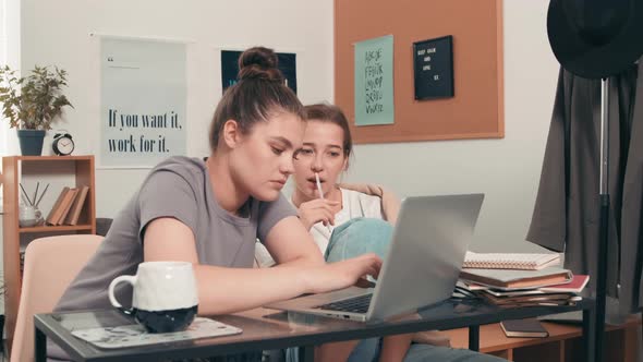 Female Students Studying Together in Dorm Room