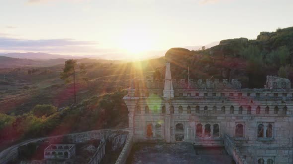 Drone aerial panorama of Termas Radium Hotel Serra da Pena at sunset in Sortelha, Portugal