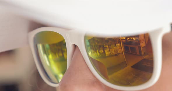 Close-up of Woman Wearing Mirrored Sunglasses