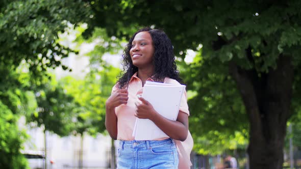 African Student Girl with Notebooks in City