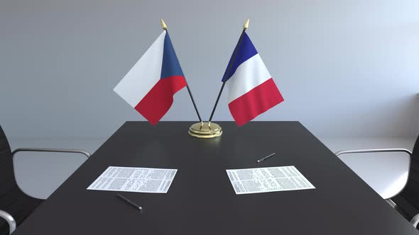 Flags of the Czech Republic and France on the Table alt