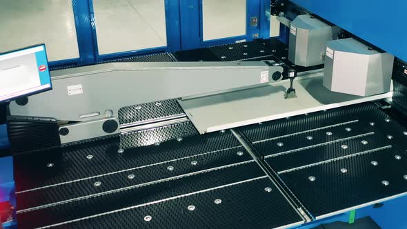 Industrial Mechanism Is Processing an Aluminum Plate