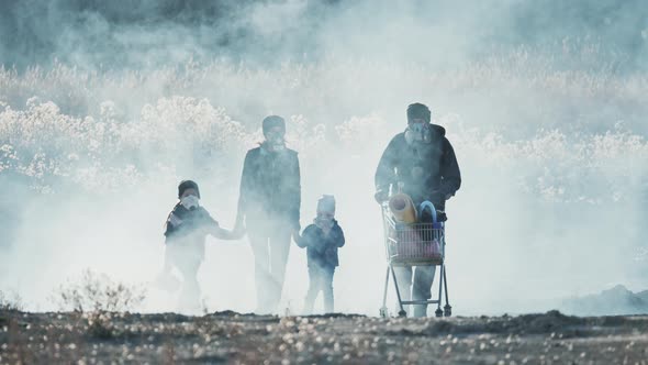 Survivor Family in Gas Mask Going Through Clouds of Toxic Smoke